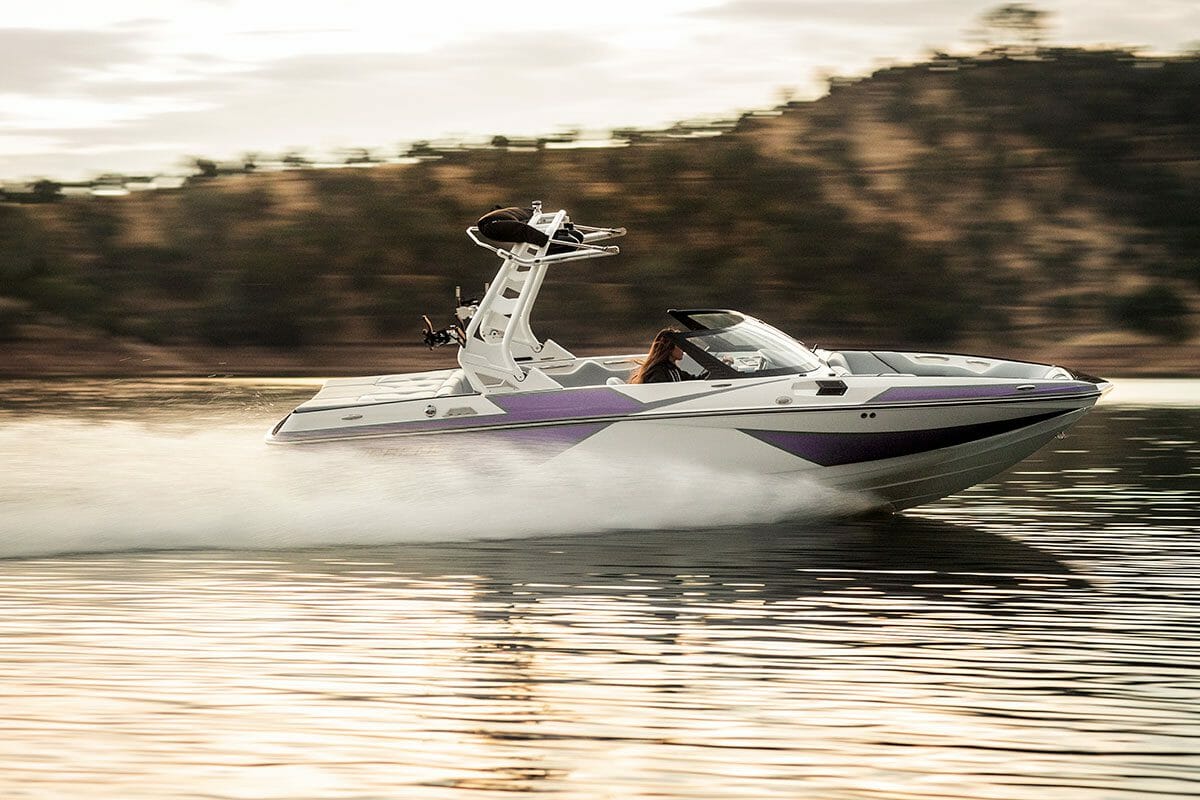 Purple & White Supreme S211 flying across the lake