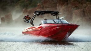 Red Supreme ZS212 speeding across lake