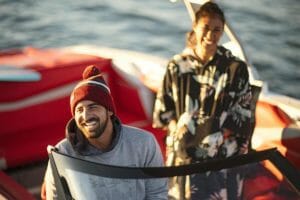 Happy Smiling couple in a Supreme boat